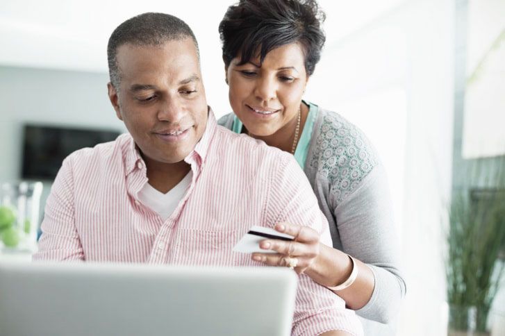 Mature couple shopping online together