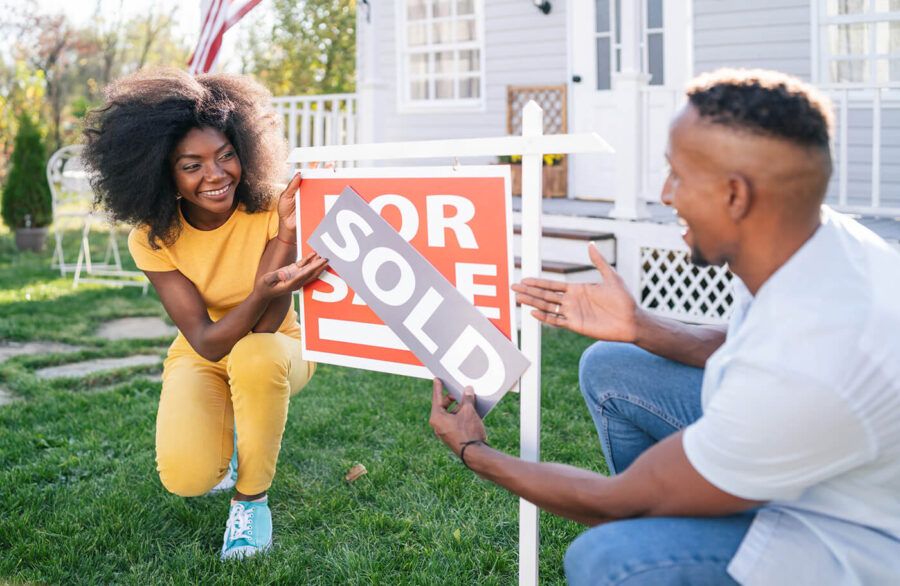 Young African American couple buying a new house