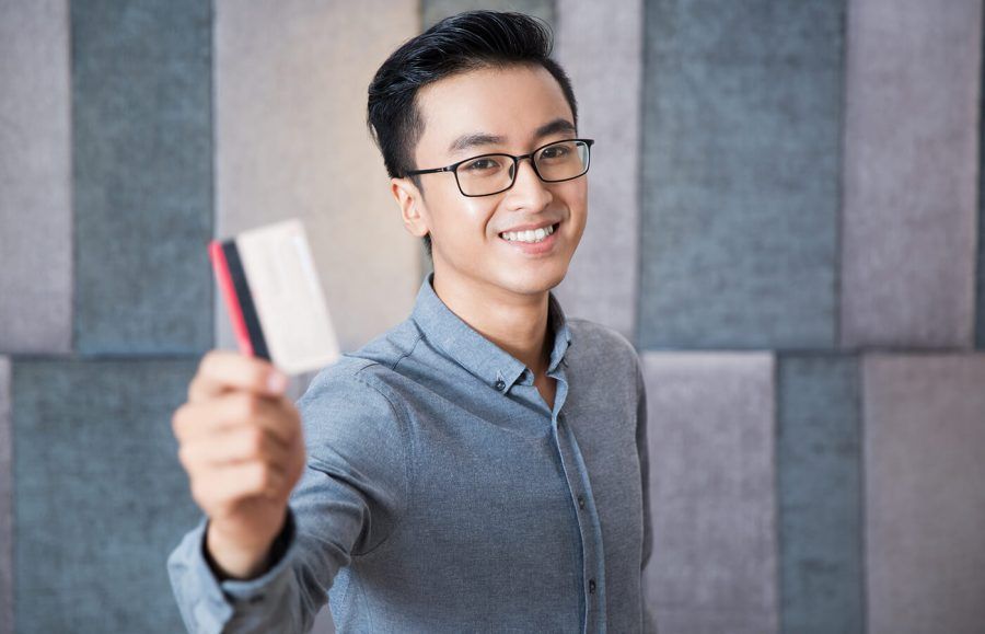 A man holding a credit card.