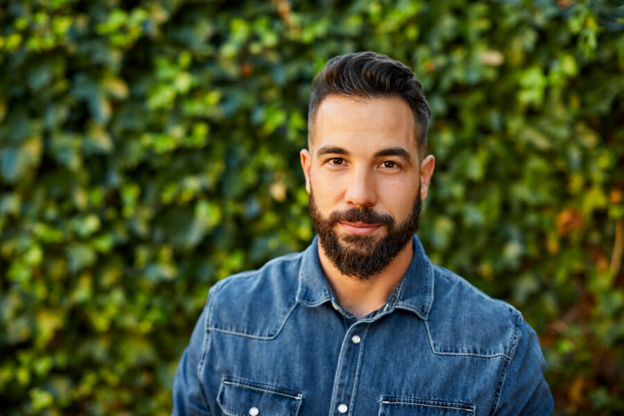 man with trimmed beard in blue button down shirt
