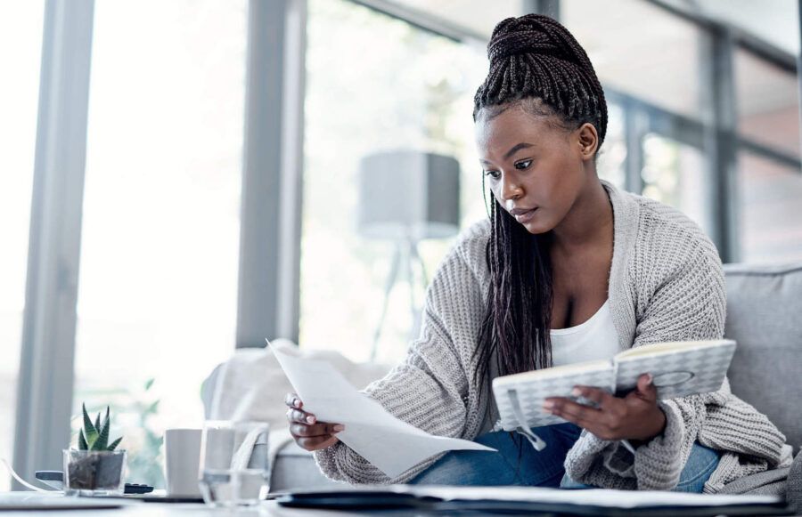 woman researching difference between debtor and creditor