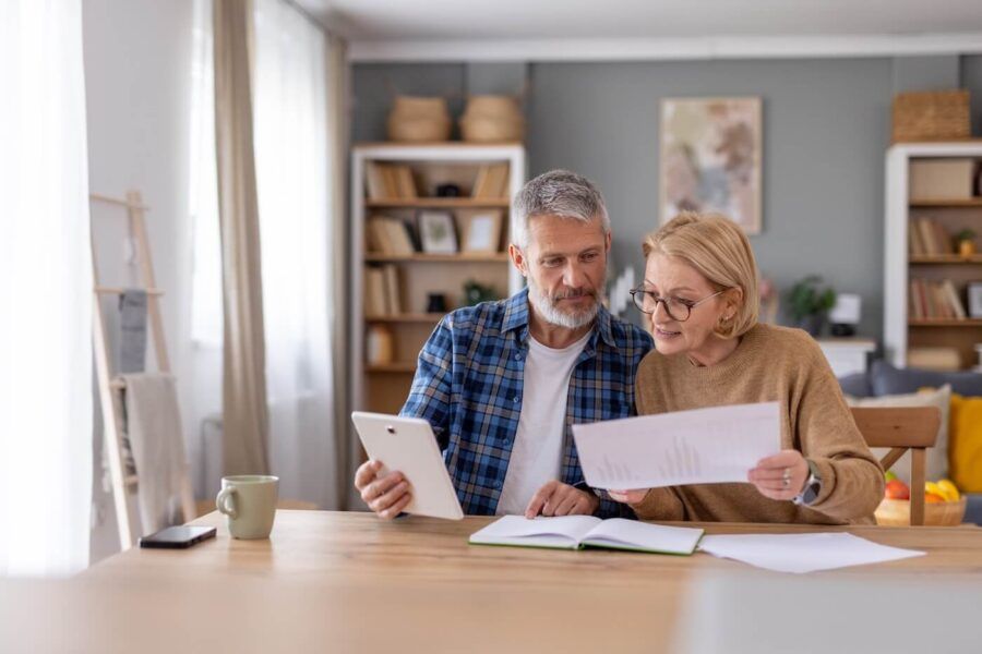 Senior couple planning their finances at home