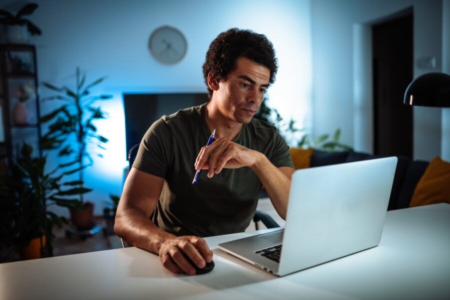 Portrait of mid adult man using a laptop