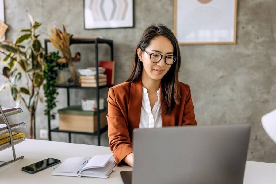 Businesswoman using her laptop in the office
