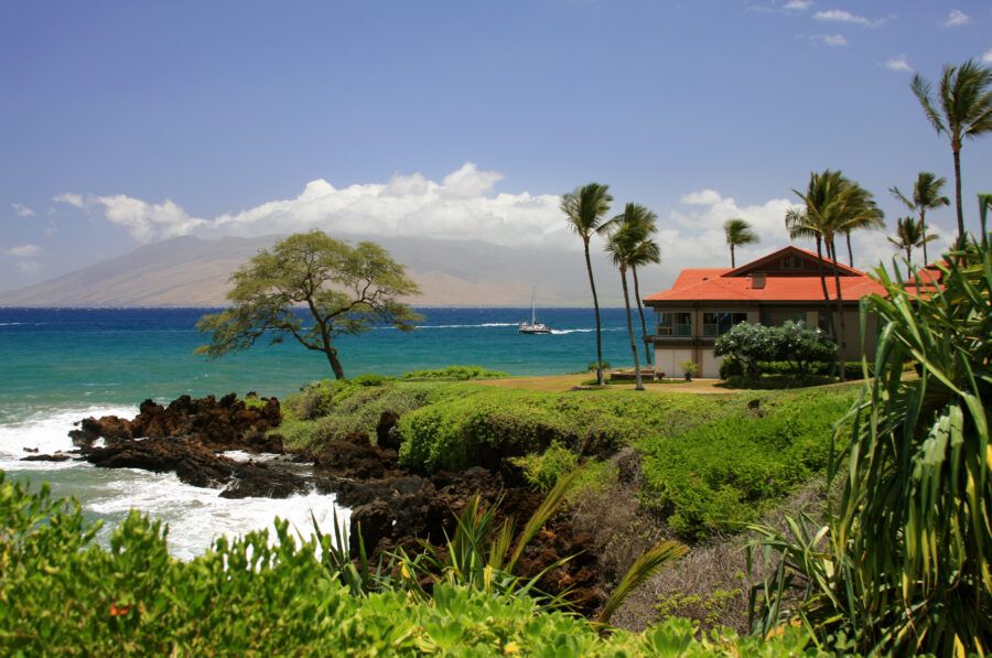 A house on the Maui coastline overlooking a small peninsula.