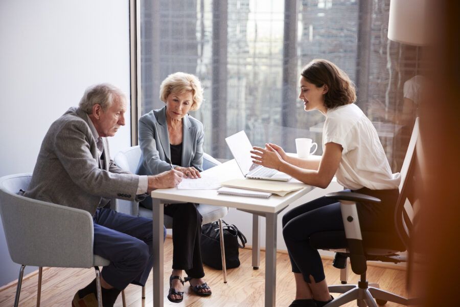 Senior Couple estate planning In a Meeting With Estate planner in office