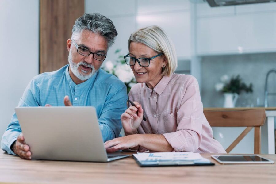 Senior couple are busy with financial planning at home