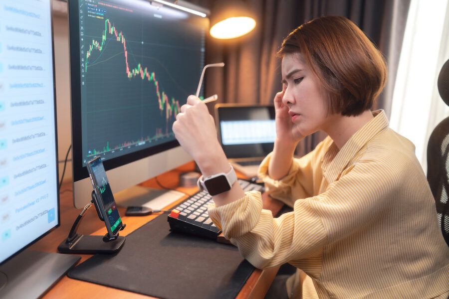 Woman stressed of business financial crisis and investing online trading in stock