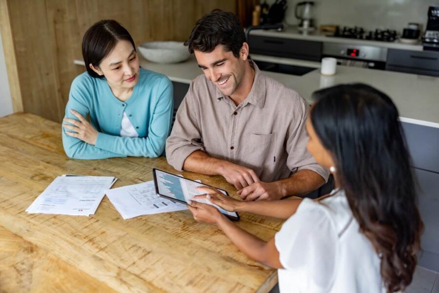 Couple discussing mortgage rates with the female agent