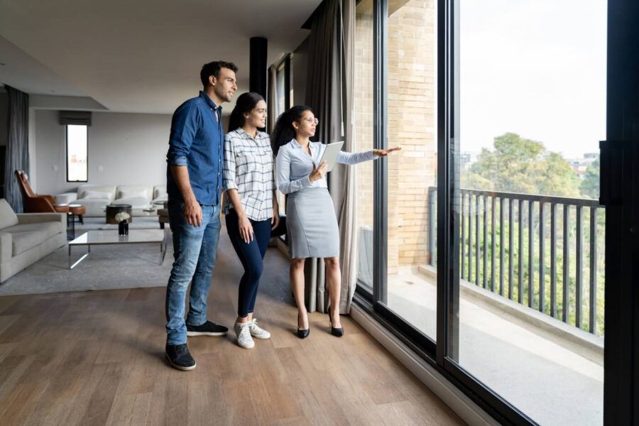 A real estate agent shows an apartment to prospective clients