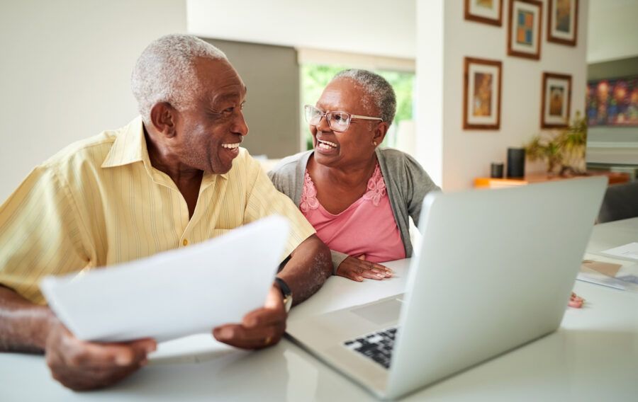 Shot of a senior couple discussing life insurance together