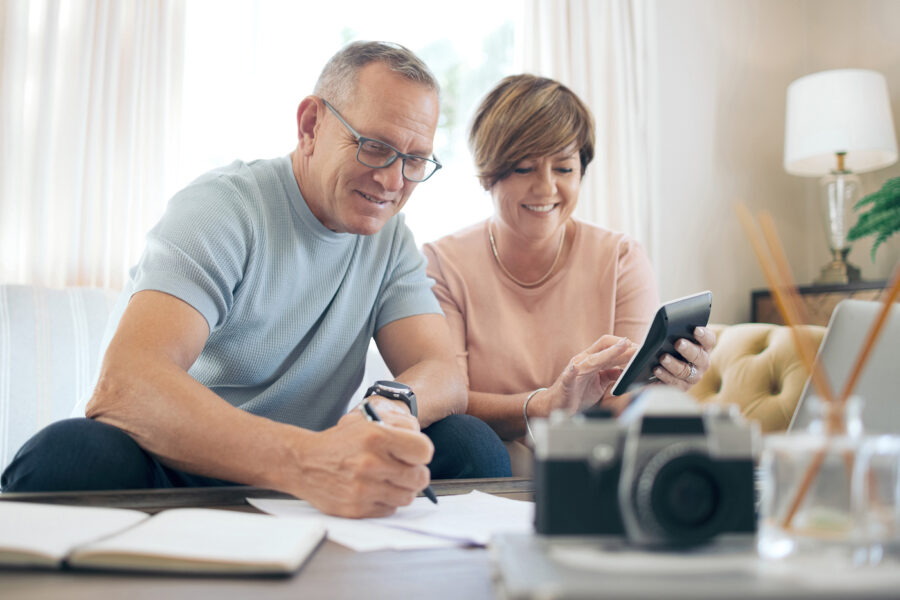 Senior couple calculating savings and researching thhrift savings plan