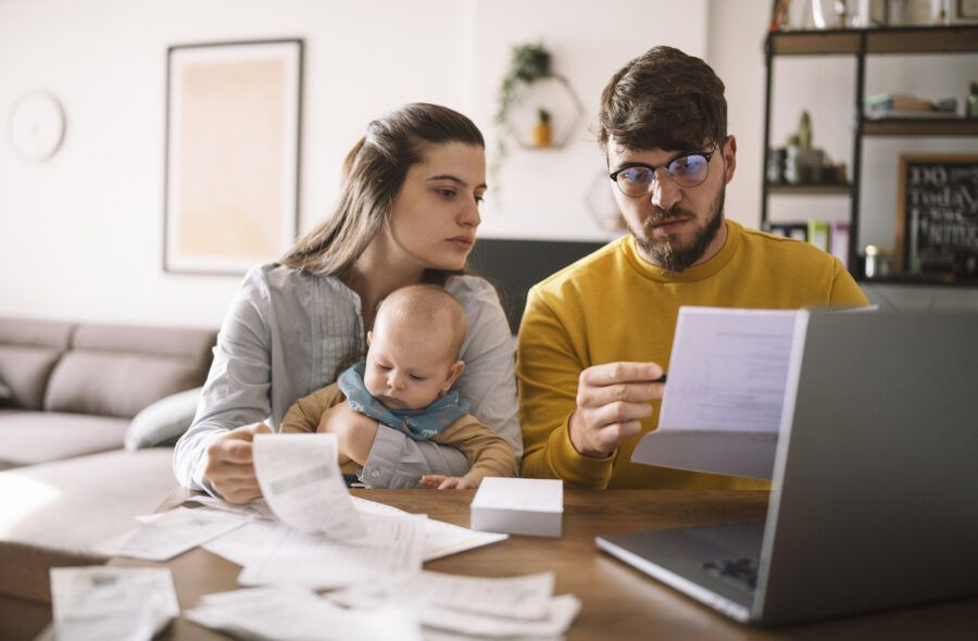 Young family with baby worried about debt.