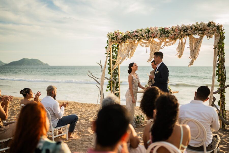 Groom and bride in wedding ceremony on the beach