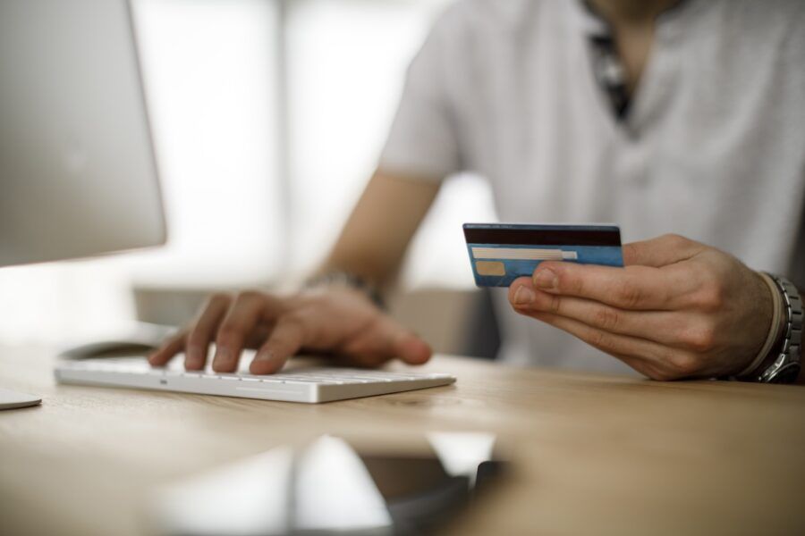 A man using a credit card online.