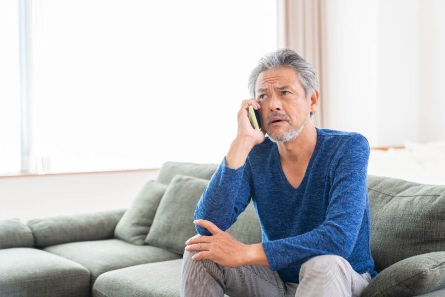 Concerned man making a phone call