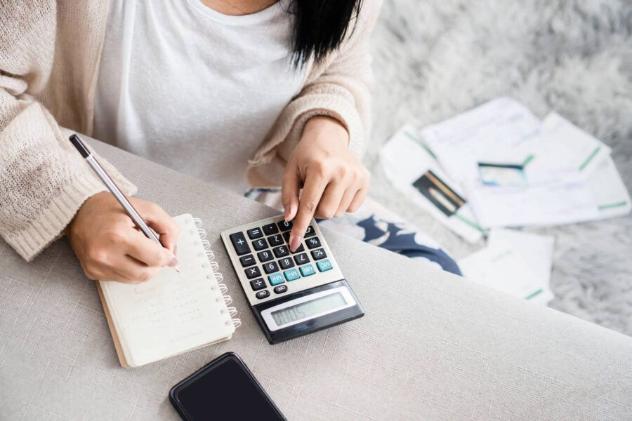 Young woman trying to budget while on a fixed income.